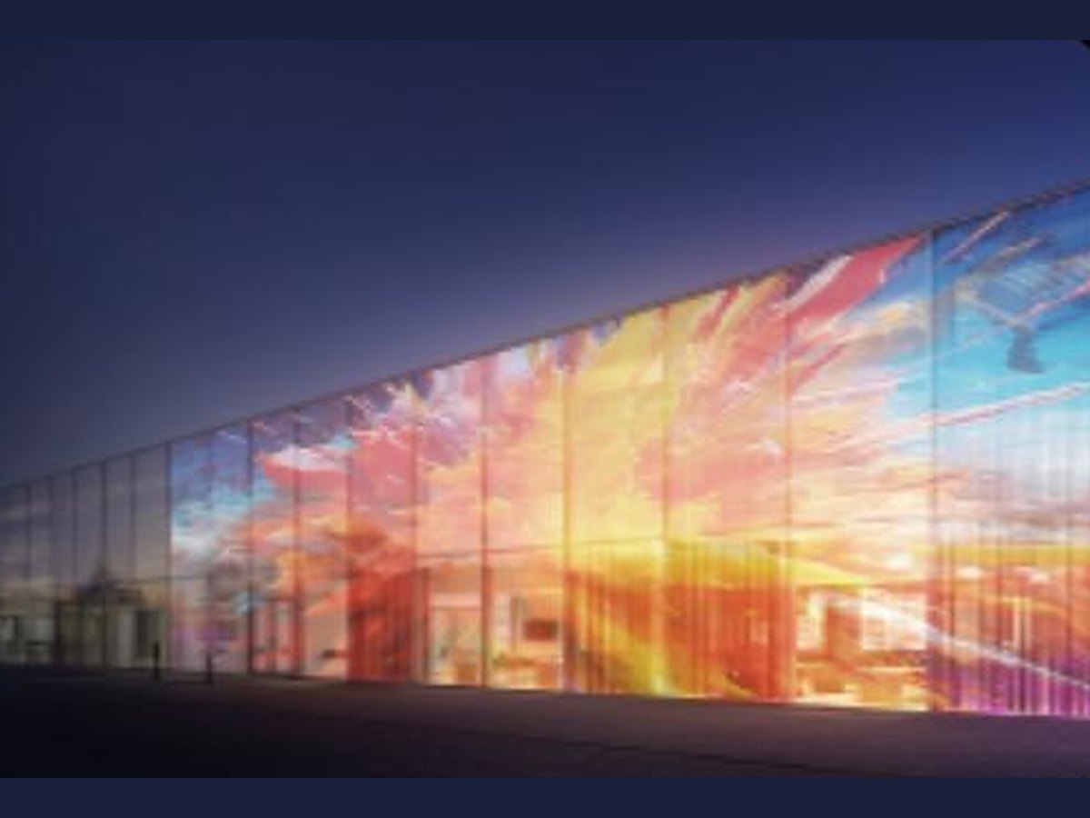 Transparent LED film across a glass curtain wall